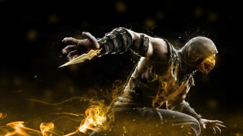 Скорпион / Scorpion из игры Mortal Kombat X / Mortal Kombat X в боевом костюме, вытягивает руку с золотым клинком