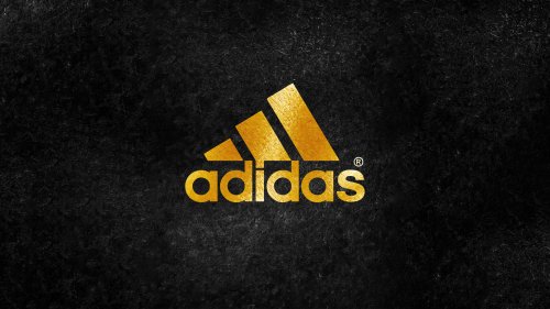 Логотип фирмы Adidas на черном фоне